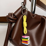 Llavero metálico "More books, please"