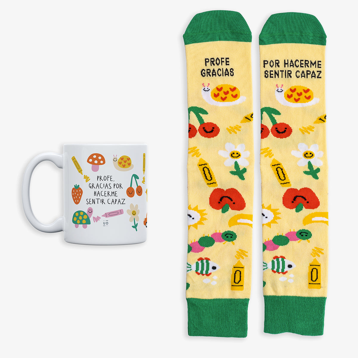 Kit Taza + Calcetines "Profe, gracias por hacerme sentir capaz"